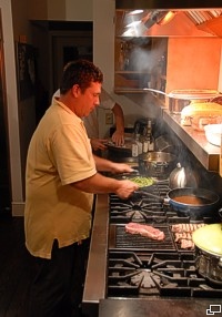 Chef Craig Kennah at work on some perfect steaks.